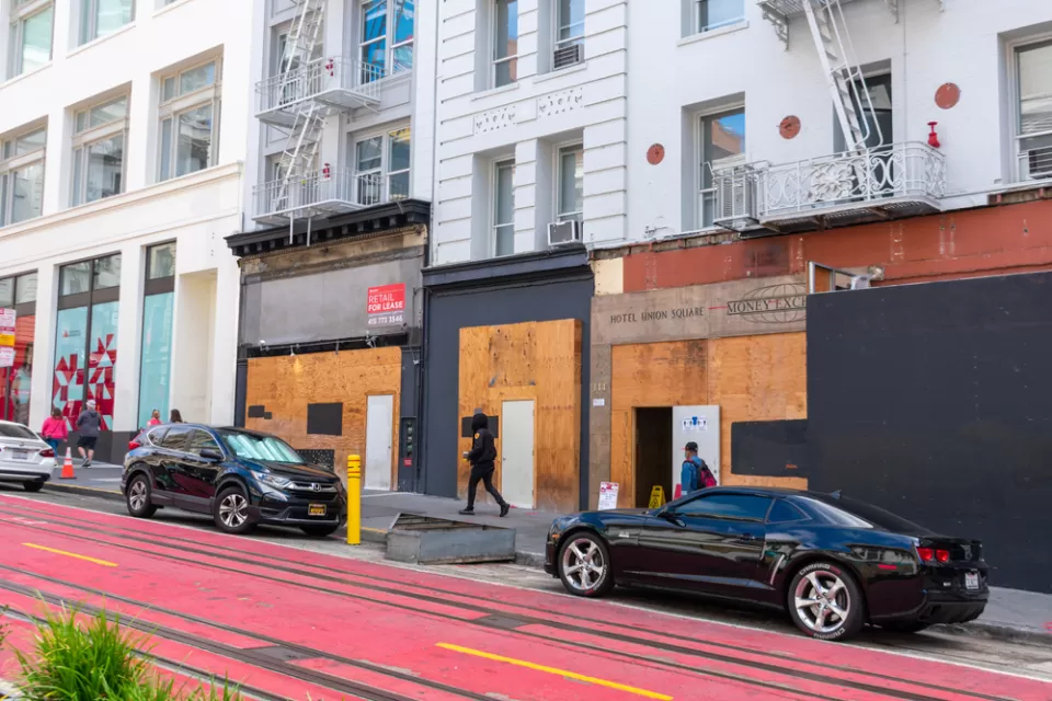 Vacant boarded-up storefronts along Powell Street in San Francisco, California.